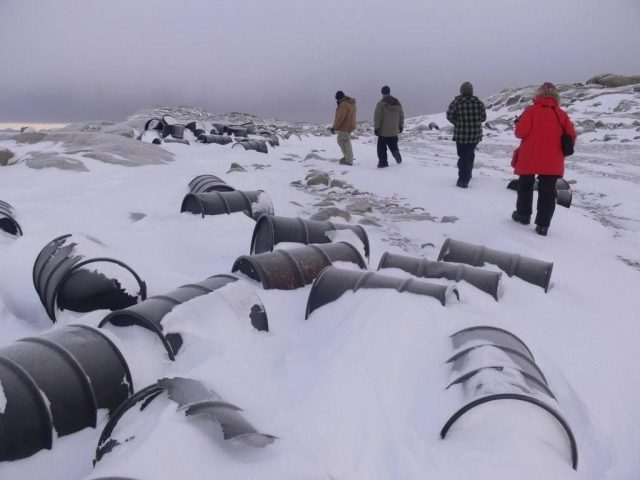 Other countries have removed waste disposal and contaminated sites in Antarctica but there are still several abandoned stations, waiting for their turn to be dismantled. In this picture, abandoned fuel drums at the now-closed Wilkes Station. Photograph by Troy Metcalfe