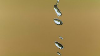 ‘Microlightning’ in water droplets, a twist in the Miller-Urey experiment